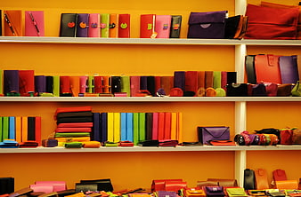 Colorful leather wallets and accessories on retail shelves