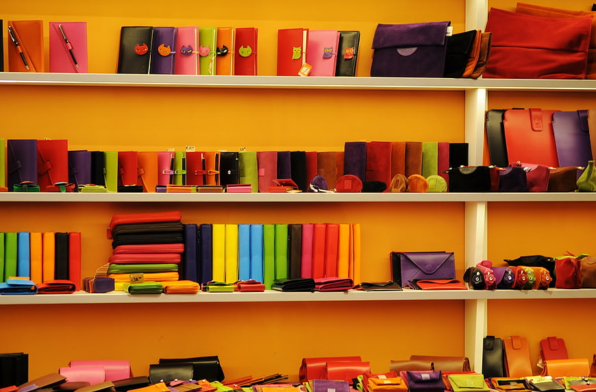Colorful leather wallets and accessories on retail shelves