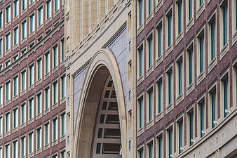 Modern Brick Building with Large Stone Archway