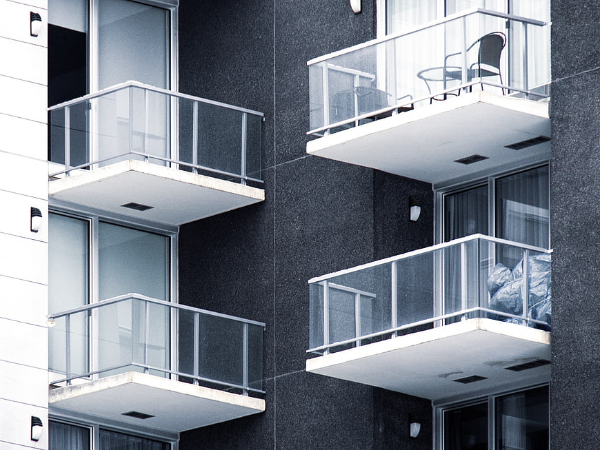 Modern Apartment Building Facade with Glass Balconies