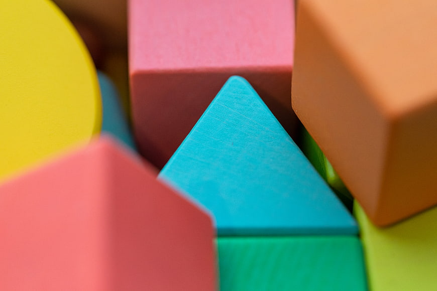 Close-up of colorful wooden geometric blocks for children