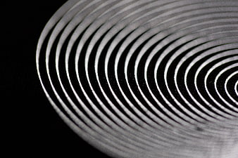 Abstract black and white concentric spiral pattern background