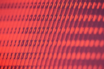 Close-up of red textured surface with diagonal pattern