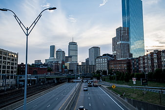 Boston skyline and highway at dusk with skyscrapers