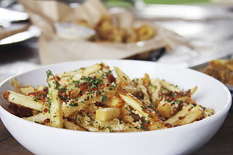 Gourmet Truffle Fries in White Bowl with Herbs