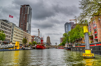 Wijnhaven Canal in Rotterdam with Red Ship and Modern Architecture