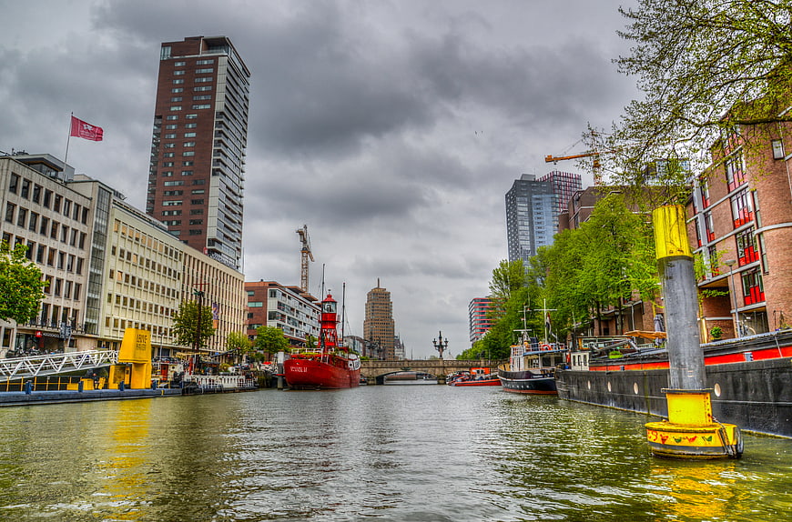 Wijnhaven Canal in Rotterdam with Red Ship and Modern Architecture