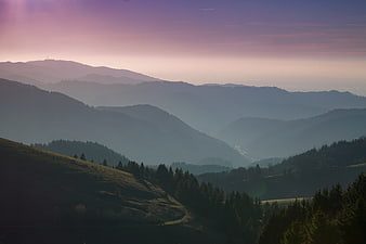 Misty Mountain Landscape at Dawn with Purple Sky