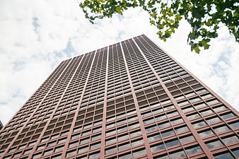 Low angle view of modern red brick office skyscraper