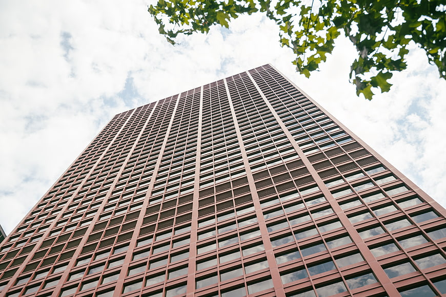 Low angle view of modern red brick office skyscraper