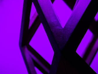 Abstract purple geometric shapes with dark metallic texture