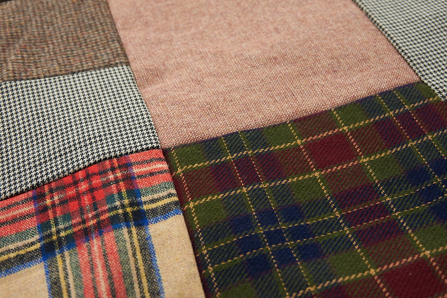 Close-up of various plaid and patterned fabric textures