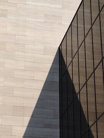 Modern architectural facade with geometric shadow pattern