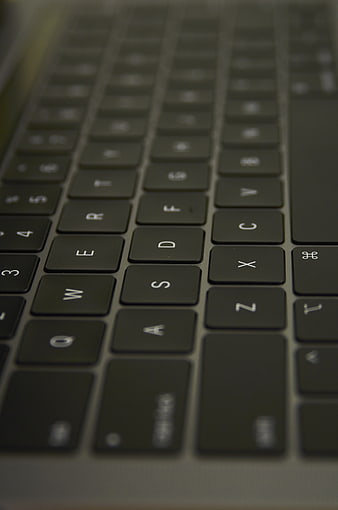 Close-up of laptop keyboard keys with shallow depth of field