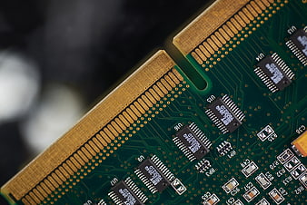 Close-up of green computer RAM module circuit board