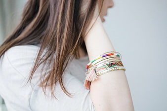 Close-up of woman wearing colorful boho bracelets
