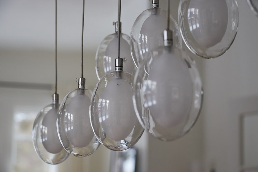 Modern hanging glass pendant lights in interior design