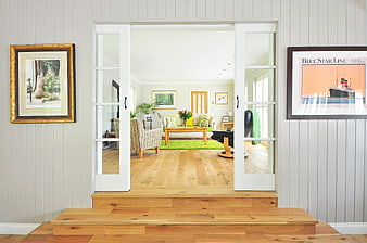 Bright Living Room Interior with Wooden Floors and French Doors