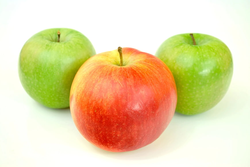 Red Apple with Two Green Apples on White Background