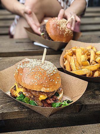 Delicious Gourmet Burger with Fries on Wooden Table