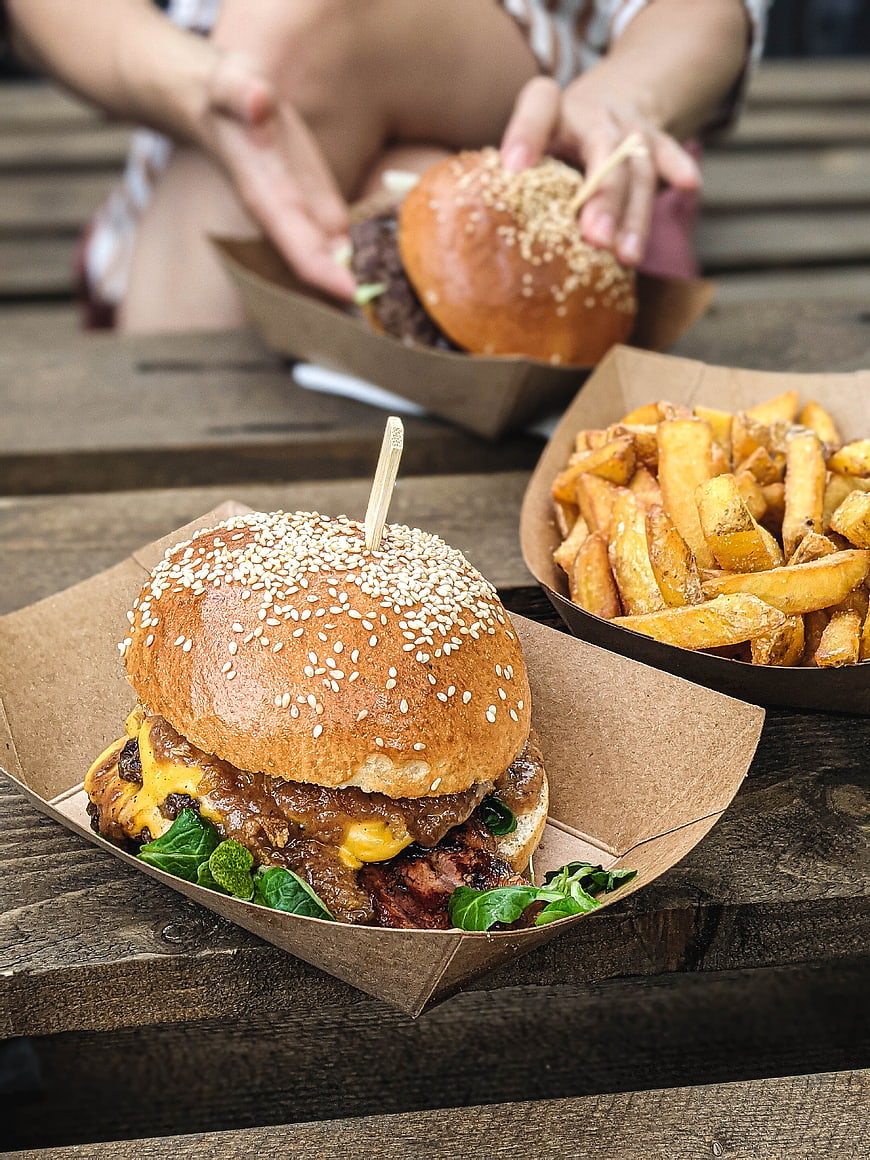 Delicious Gourmet Burger with Fries on Wooden Table