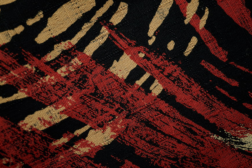 Abstract Red Black and Beige Woven Fabric Texture