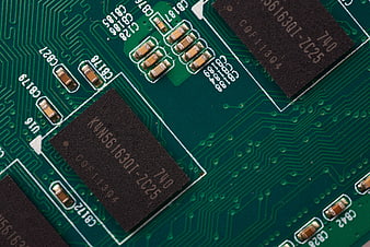 Macro shot of green circuit board with electronic chips