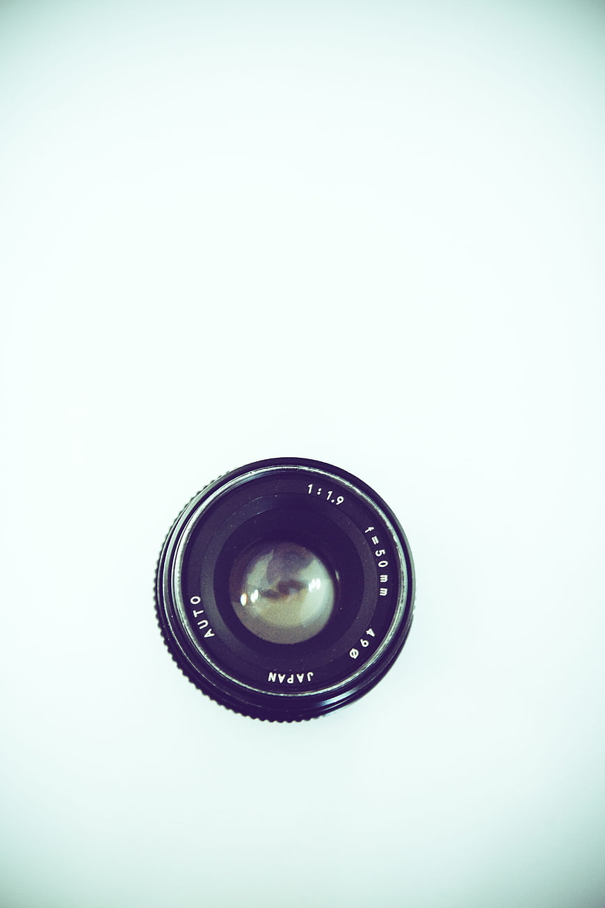 Vintage 50mm Camera Lens on White Background