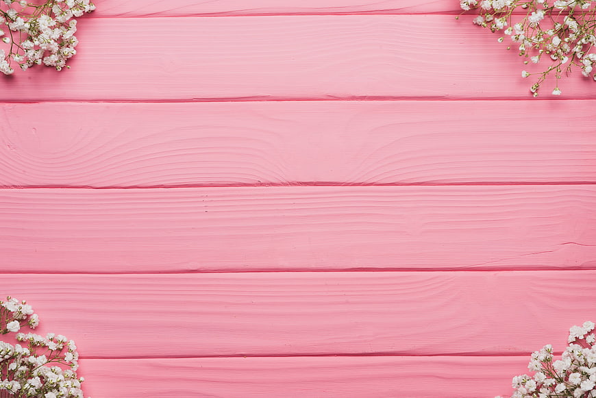 White Baby's Breath Flowers on Pink Wooden Background
