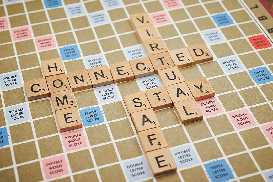 Scrabble tiles spelling connected, virtual, stay safe on board