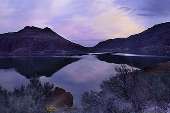 Serene Purple Lake Reflection Between Rocky Mountains at Dusk