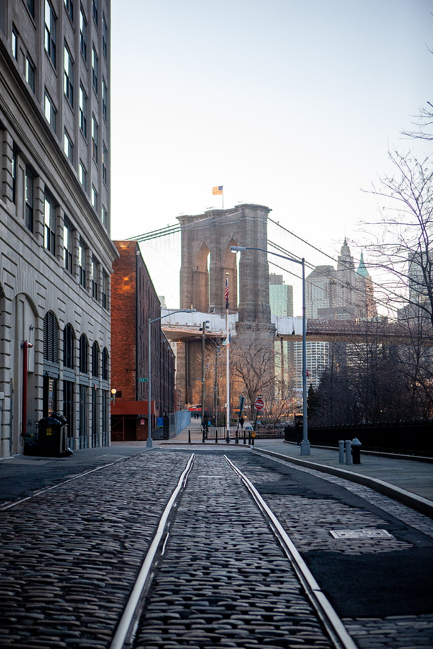 Cobblestone street leading to Brooklyn Bridge in New York City