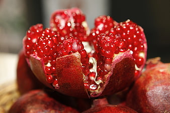 Close-up of Fresh Open Red Pomegranate with Juicy Arils