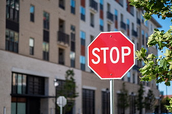 Red Stop Sign in Urban City Setting