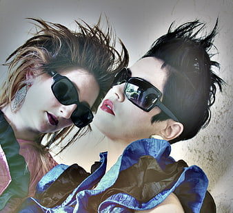 Two women with retro 80s fashion and sunglasses