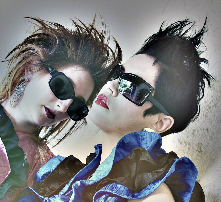 Two women with retro 80s fashion and sunglasses