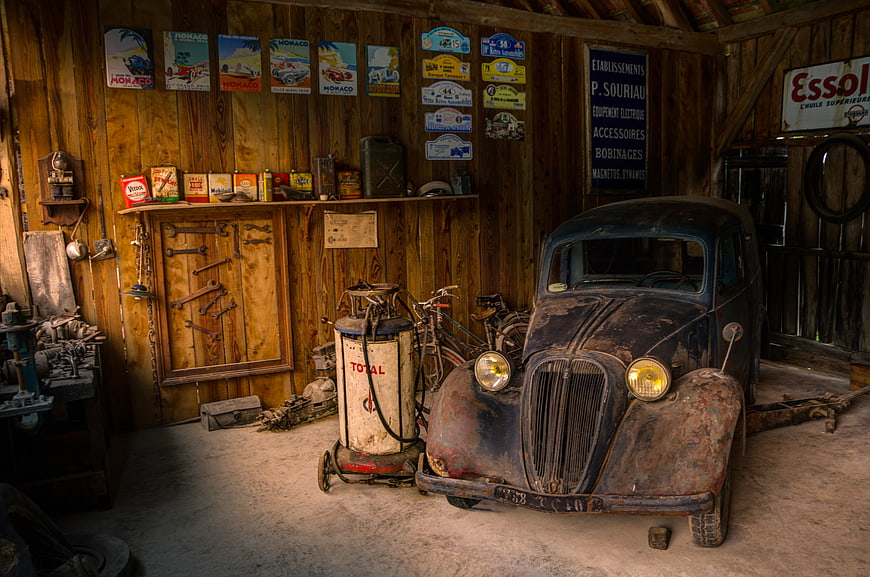 Vintage Rusty Car in Retro Wooden Garage Workshop