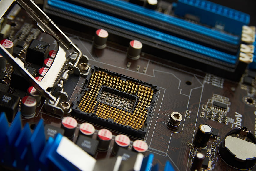 Close-up of computer motherboard CPU socket and RAM slots