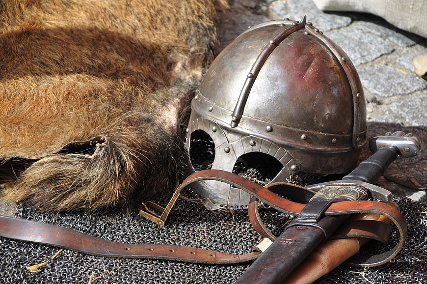 Medieval Viking Helmet, Sword, and Chainmail Armor on Fur