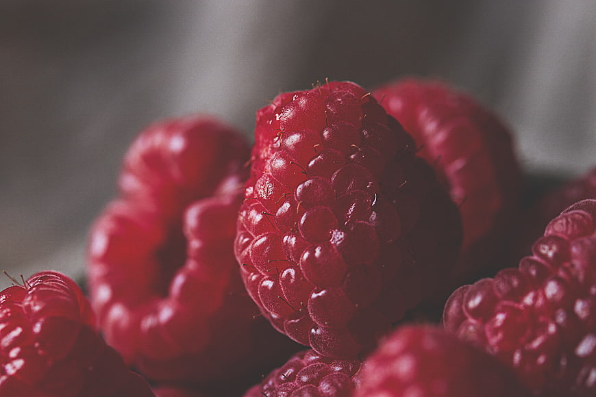 Close-up of fresh red raspberries with shallow depth of field