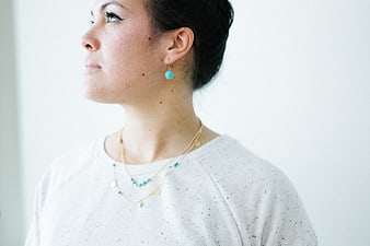 Woman Wearing Turquoise Jewelry and White Sweater