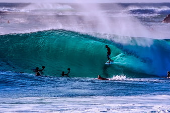 Surfer Riding Inside a Massive Turquoise Barrel Wave