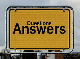 Yellow road sign with questions and answers text