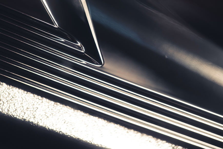 Abstract Close-Up of Chrome Metal Texture with Light Reflections