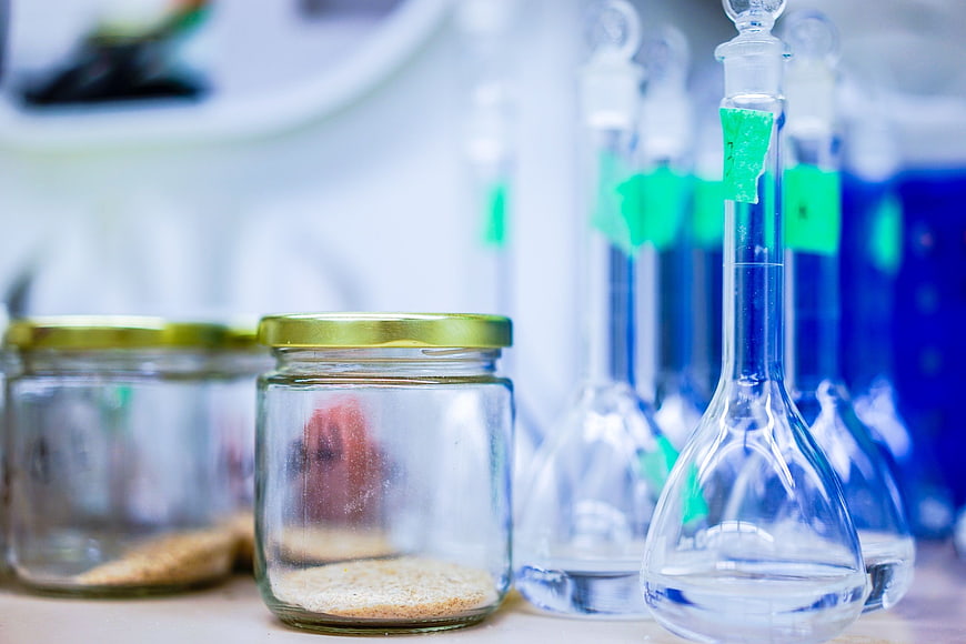 Laboratory glass jars and flasks with chemical samples