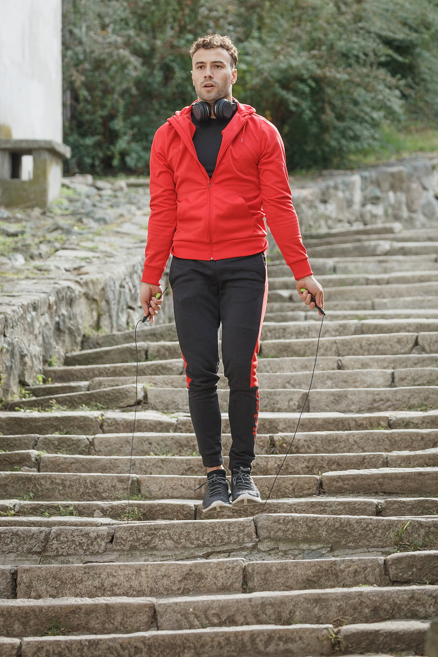 Athletic Man Jumping Rope on Outdoor Stone Stairs