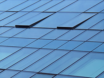 Modern Blue Glass Building Facade with Geometric Pattern