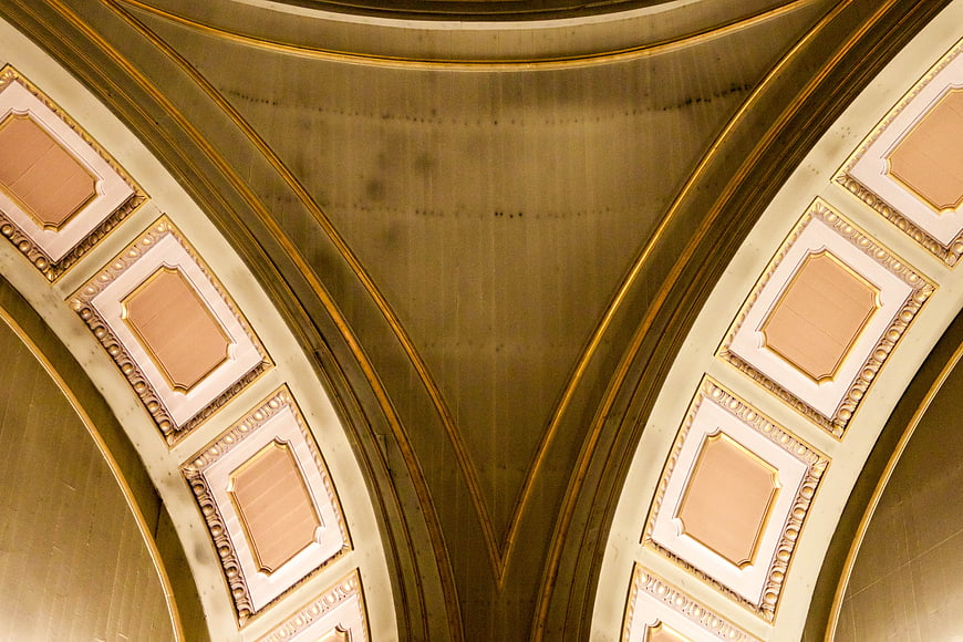 Symmetrical Gold and Cream Vaulted Ceiling Architecture