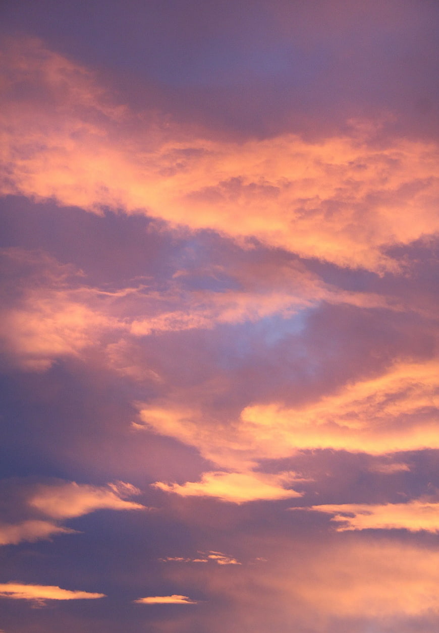 Vibrant Orange and Purple Sunset Clouds Sky