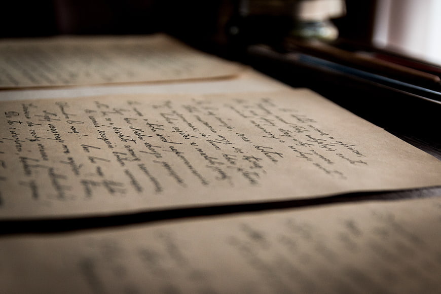 Vintage handwritten letters on aged paper with shallow depth of field